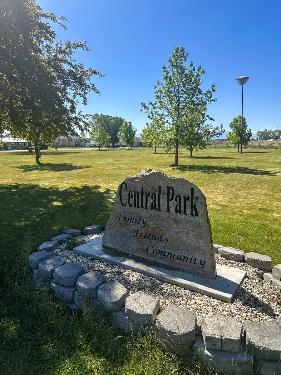 The engraved stone marker at the entrance to Central Park in Heyburn, reading “Family, Friends, Community”.