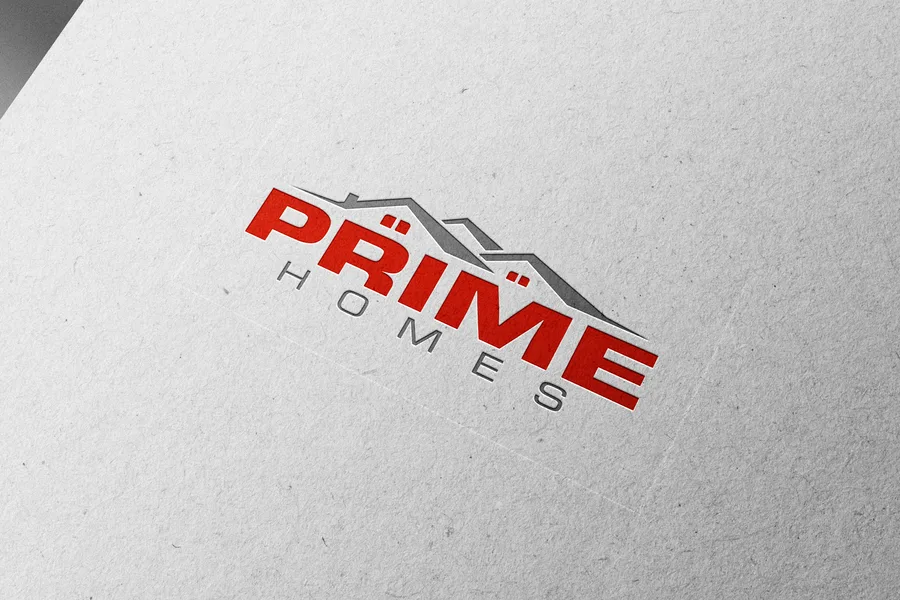 Prime Homes logo in red, a roofline over the name, shown embossed on paper.