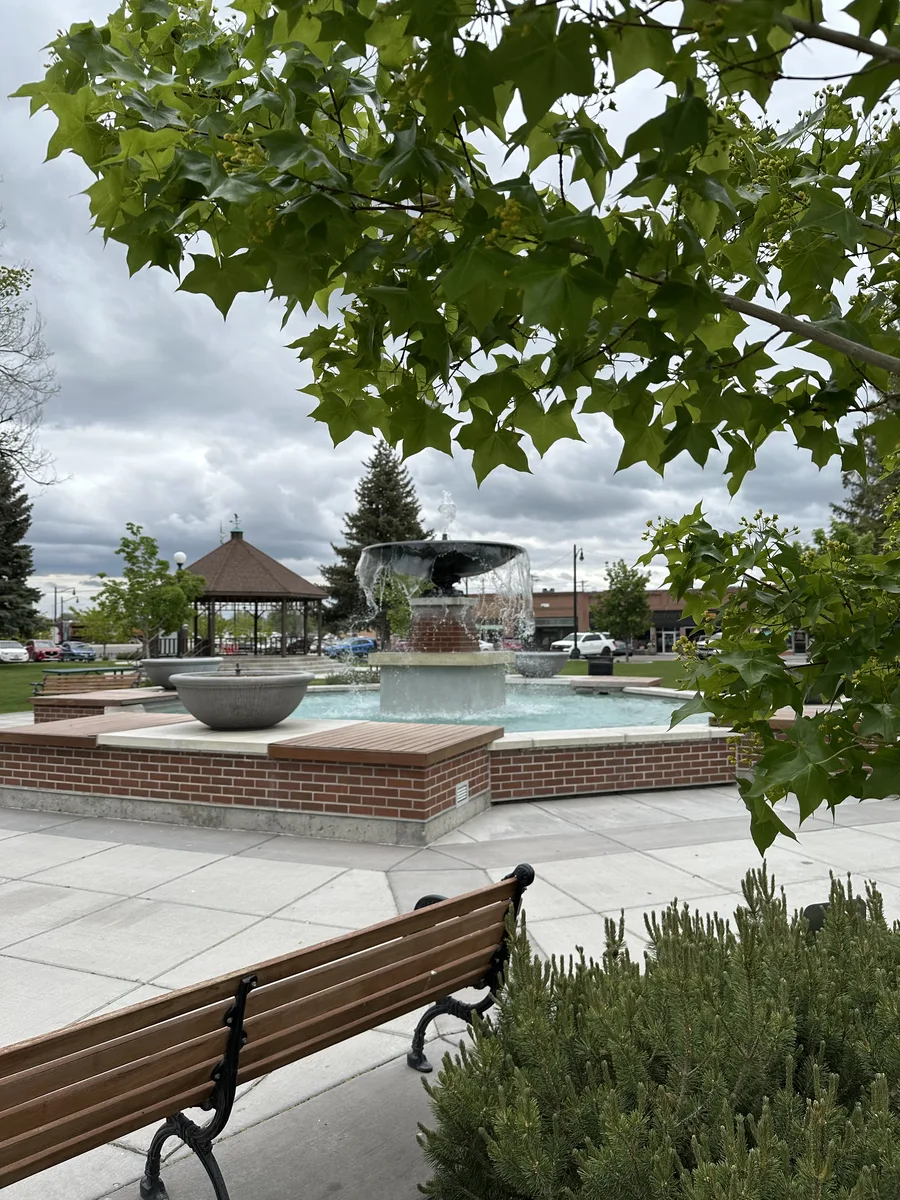 The fountain on Rupert Square, with the gazebo and the downtown storefronts behind it.